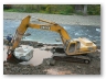 Installing Extra Heavy Stone Fill Keyway along Old State Road 17.
